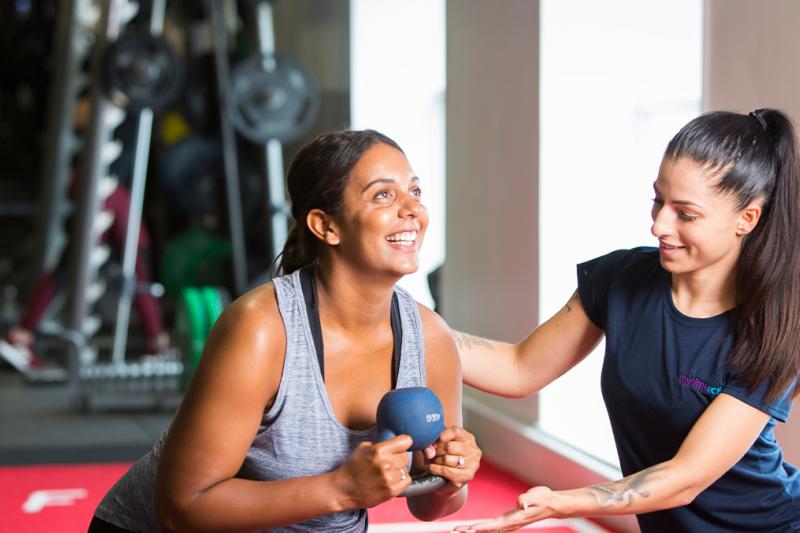 Lady with personal trainer